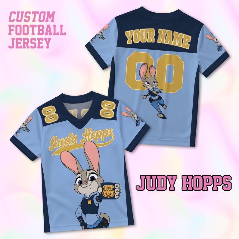 May include: Light blue custom football jersey featuring the character Judy Hopps from Zootopia. The jersey has navy blue accents, the number 8, and the name "Judy Hopps" in a yellow script. The back of the jersey has the number 00 and the text "YOUR NAME".
