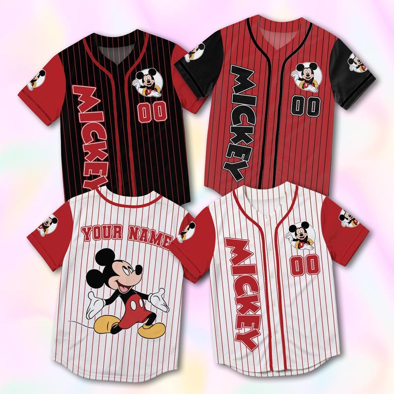May include: Four baseball jerseys featuring Mickey Mouse. Two jerseys are red and black, with "Mickey" printed vertically. The other two are white with red pinstripes, one with "Your Name" and the other with "Mickey". Each jersey has the number "00".