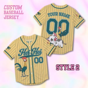 May include: A tan baseball jersey with dark green pinstripes, featuring the text "Hei Hei" and "00" on the front, and "YOUR NAME" with "00" on the back. The design includes a cartoon rooster and a piglet graphic on the back of the jersey.