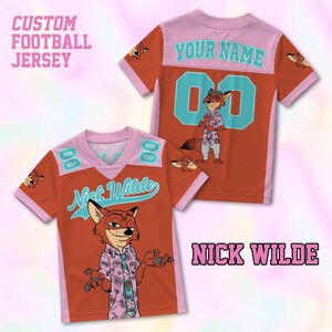 May include: Two orange custom football jerseys with pink and teal accents. One jersey features the text "Nick Wilde" and a cartoon fox character. The other jersey has the text "Your Name" and the number "00". The text "CUSTOM FOOTBALL JERSEY" is at the top.