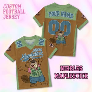 May include: Custom football jersey in brown, green, and blue, featuring a cartoon beaver mascot. The jersey has the text "Nibbles Maplestick" and "Your Name" with the number "00". The jersey is short-sleeved.