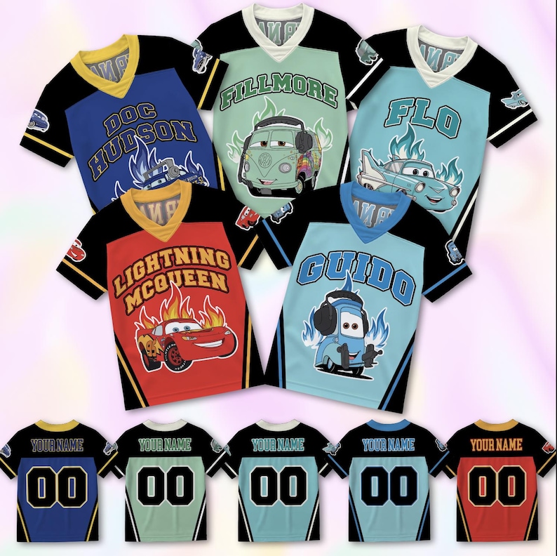 May include: Five short-sleeve V-neck jerseys featuring Disney Pixar Cars characters Doc Hudson, Fillmore, Flo, Lightning McQueen, and Guido. Each shirt displays the character name, a graphic of the car, and flames. The backs show the text YOUR NAME and 00.