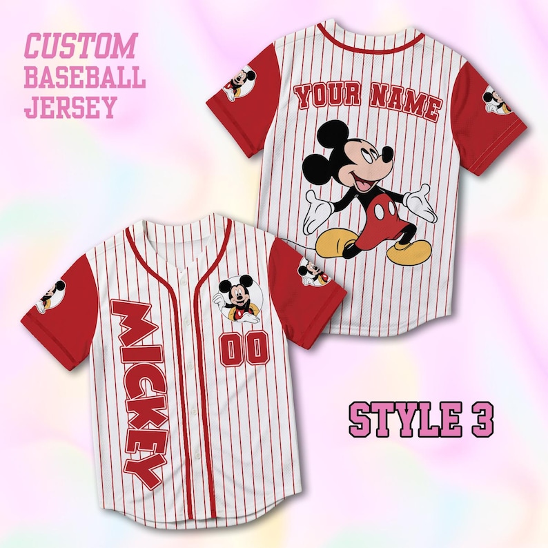 May include: Two custom baseball jerseys. One jersey features "YOUR NAME" and a Mickey Mouse graphic. The other jersey has "MICKEY" and the number "00". Both are white with red pinstripes and sleeves, and a Mickey Mouse patch on the sleeve.