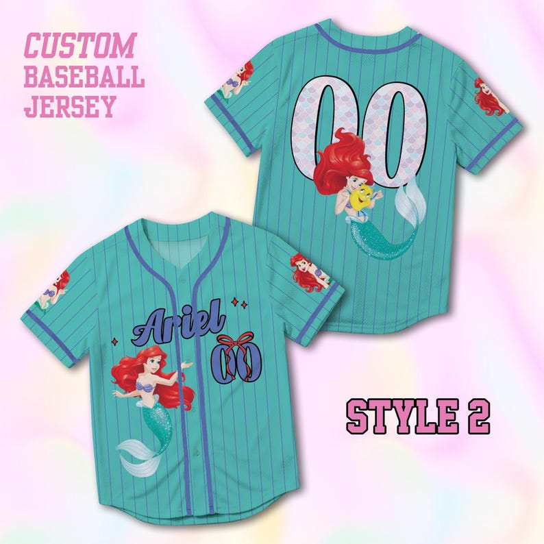 May include: Teal baseball jersey featuring Ariel from The Little Mermaid. The jersey has a button-up front, blue pinstripes, and the text "Ariel" and the number "00". Ariel graphics are on the sleeves. The text "CUSTOM BASEBALL JERSEY" and "STYLE 2" are also visible.