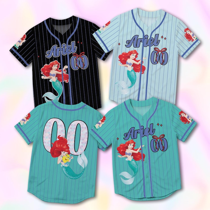 May include: Four baseball jerseys in black, light blue, and teal. Each jersey features the name "Ariel" and the number "00" with a mermaid graphic. The jerseys have a pinstripe design and are short-sleeved.