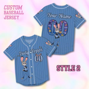 May include: Light blue baseball jersey with white pinstripes, featuring a cartoon bunny character. The jersey has the text "Judy Hopps" and "Your Name" on the front and back, with the number "00". The words "Custom Baseball Jersey" and "Style 2" are also visible.
