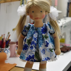 PDF sewing pattern and tutorial for vintage-style doll dress with puff sleeves and floral embroidered collar. Fits 18-20 inch Waldorf dolls. Elegant and classic look.