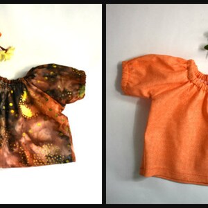 A collage of six doll clothing items. Top left: white blouse with wide lace collar and pearl buttons. Top right: linen overalls with orange puff-sleeve shirt. Center: long-sleeve floral dress in navy with pink and orange flowers. Bottom right: denim jeans with front pockets. Small inset photos show a white romper and an orange off-shoulder blouse. All designed for 18" dolls.