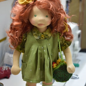 PDF sewing pattern and tutorial for vintage-style doll dress with puff sleeves and floral embroidered collar. Fits 18-20 inch Waldorf dolls. Elegant and classic look.