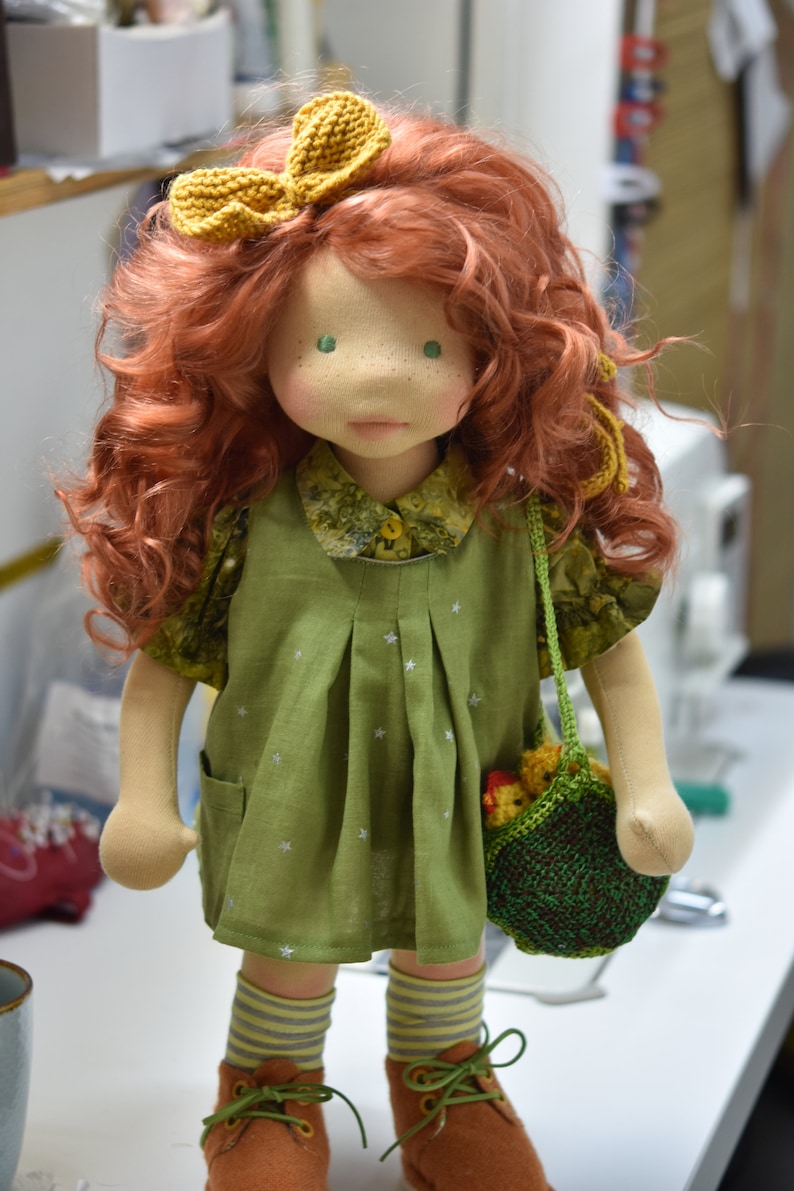 PDF sewing pattern and tutorial for vintage-style doll dress with puff sleeves and floral embroidered collar. Fits 18-20 inch Waldorf dolls. Elegant and classic look.