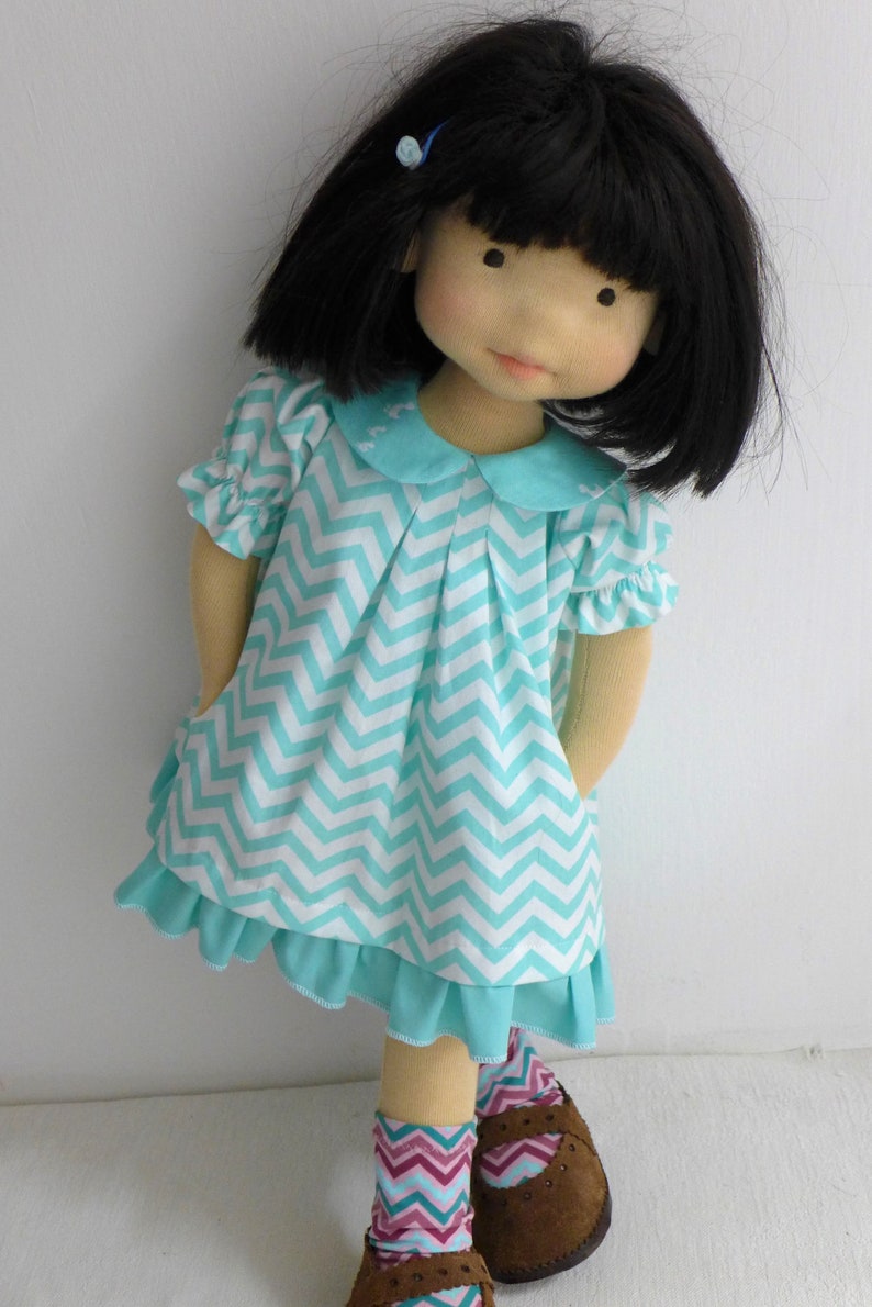 PDF sewing pattern and tutorial for vintage-style doll dress with puff sleeves and floral embroidered collar. Fits 18-20 inch Waldorf dolls. Elegant and classic look.