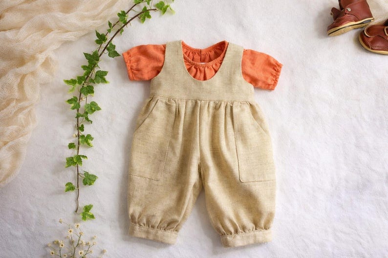 Summer doll clothes sewing pattern set for Waldorf dolls, includes linen romper, white ruffle blouse, denim pants, floral dress, and lace-trimmed playsuit. Handmade doll outfit tutorial, PDF download, perfect for 15-18 inch dolls and DIY doll wardrobes