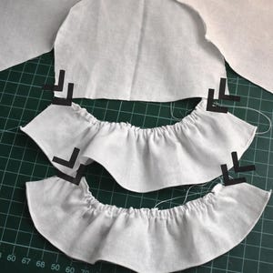 Summer doll clothes sewing pattern set for Waldorf dolls, includes linen romper, white ruffle blouse, denim pants, floral dress, and lace-trimmed playsuit. Handmade doll outfit tutorial, PDF download, perfect for 15-18 inch dolls and DIY doll wardrobes