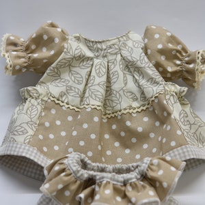 PDF sewing pattern and tutorial for vintage-style doll dress with puff sleeves and floral embroidered collar. Fits 18-20 inch Waldorf dolls. Elegant and classic look.