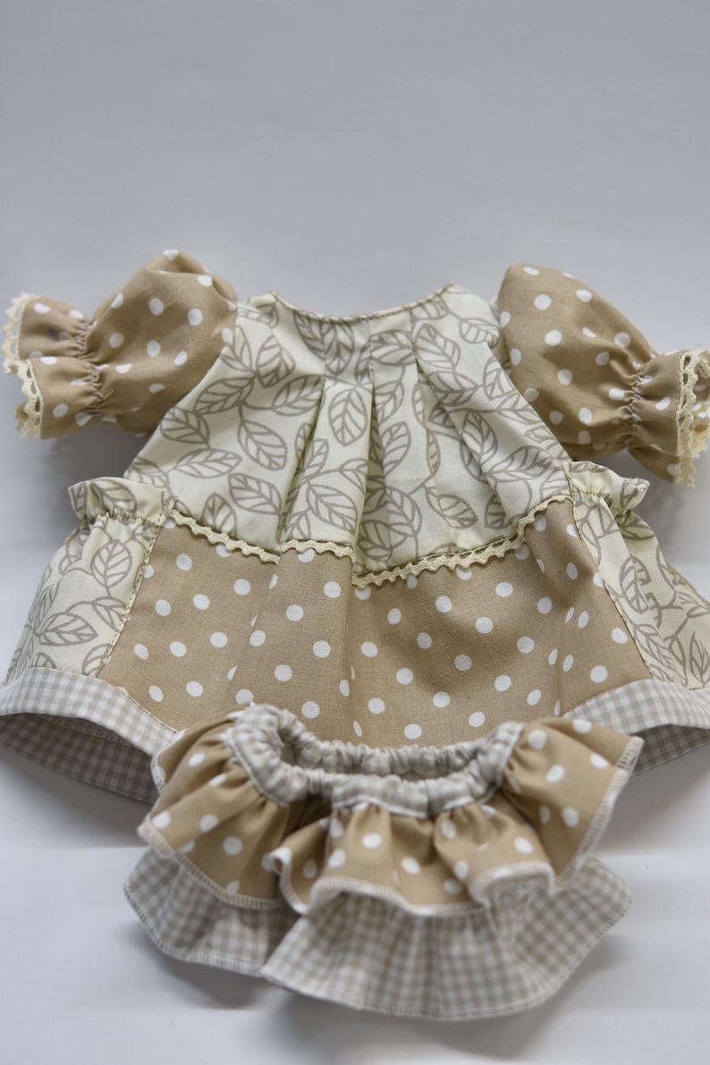 PDF sewing pattern and tutorial for vintage-style doll dress with puff sleeves and floral embroidered collar. Fits 18-20 inch Waldorf dolls. Elegant and classic look.