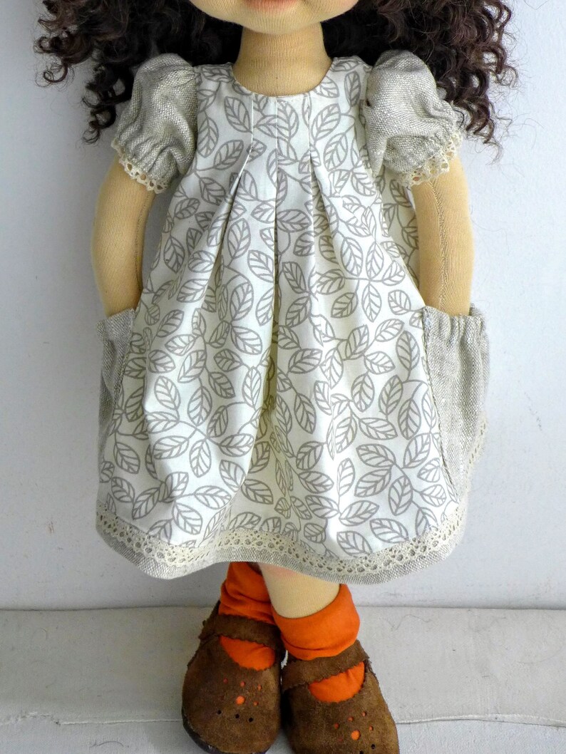 PDF sewing pattern and tutorial for vintage-style doll dress with puff sleeves and floral embroidered collar. Fits 18-20 inch Waldorf dolls. Elegant and classic look.