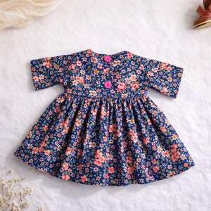Summer doll clothes sewing pattern set for Waldorf dolls, includes linen romper, white ruffle blouse, denim pants, floral dress, and lace-trimmed playsuit. Handmade doll outfit tutorial, PDF download, perfect for 15-18 inch dolls and DIY doll wardrobes