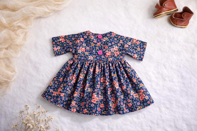 Summer doll clothes sewing pattern set for Waldorf dolls, includes linen romper, white ruffle blouse, denim pants, floral dress, and lace-trimmed playsuit. Handmade doll outfit tutorial, PDF download, perfect for 15-18 inch dolls and DIY doll wardrobes