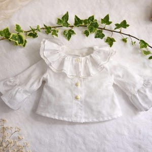 Summer doll clothes sewing pattern set for Waldorf dolls, includes linen romper, white ruffle blouse, denim pants, floral dress, and lace-trimmed playsuit. Handmade doll outfit tutorial, PDF download, perfect for 15-18 inch dolls and DIY doll wardrobes