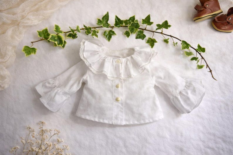 Summer doll clothes sewing pattern set for Waldorf dolls, includes linen romper, white ruffle blouse, denim pants, floral dress, and lace-trimmed playsuit. Handmade doll outfit tutorial, PDF download, perfect for 15-18 inch dolls and DIY doll wardrobes