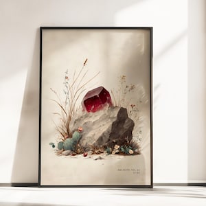 Puede incluir: Impresión enmarcada que presenta un gran rubí facetado sobre una formación rocosa gris. La obra de arte incluye flora del desierto como cactus y flores silvestres, con el texto "ARCHIVE NO. 07 RUBY" en la parte inferior. La paleta de colores es apagada con una estética vintage.