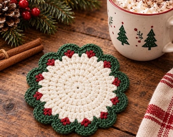 May include: A round crochet coaster featuring a cream-colored center with a scalloped border in dark green and small red accents. The coaster has a textured, circular stitch pattern and a decorative edge, showcasing a festive color palette of cream, green, and red.