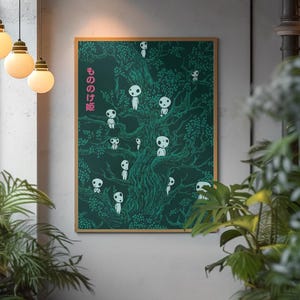 May include: A framed art print featuring a dark green illustration of a tree filled with white, spirit-like figures. The Japanese text "もののけ姫" is printed in pink on the left side. The artwork is displayed in a room with hanging lights and plants.
