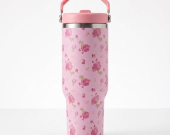 Taza de viaje isotérmica Stanley de 887 ml (30 oz) con diseño de flor rosa, tapa con pajita abatible y asa de transporte cómoda.