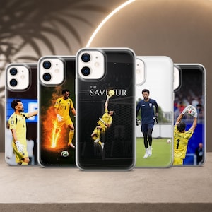 May include: Five clear phone cases featuring a football goalkeeper in various poses. One case shows the player in a yellow jersey with flames, another displays the text THE SAVIOUR above the player jumping, and others show the player in yellow or blue.