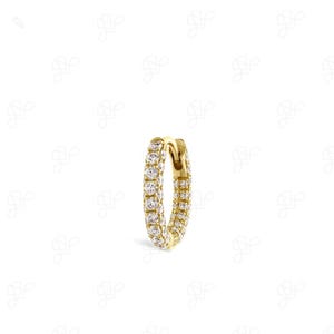 May include: A gold hoop earring featuring a continuous row of small, round, clear pavé-set stones along the outer edge. The circular hoop has a hinged mechanism at the top, showcasing a polished metallic finish and sparkling white stones.