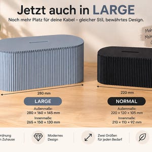 Könnte beinhalten: Eine große hellblaue und eine normale schwarze ovale Kabelbox mit gerippter Oberfläche. Die große Box misst 280 x 160 x 145 mm, die normale Box 220 x 120 x 105 mm. Der Text lautet "Jetzt auch in LARGE" sowie "NORMAL" und weitere Angaben.