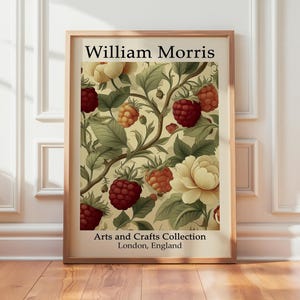 May include: Framed art print featuring a floral design with raspberries and cream-colored flowers. The print is labeled "William Morris" and "Arts and Crafts Collection, London, England."