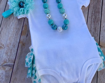 Aqua, White, and Turquoise One Piece Outfit with Ruffles on the Back, Necklace, and Headband