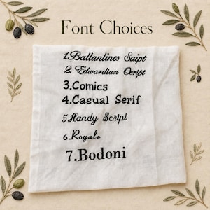 May include: A white fabric square shows seven embroidered black font options: Ballanlines Saipt, Edwardian Ceript, Comics, Casual Serif, Handy Script, Royale, and Bodoni. The words "Font Choices" are above the fonts. Olive branch designs are in the corners.