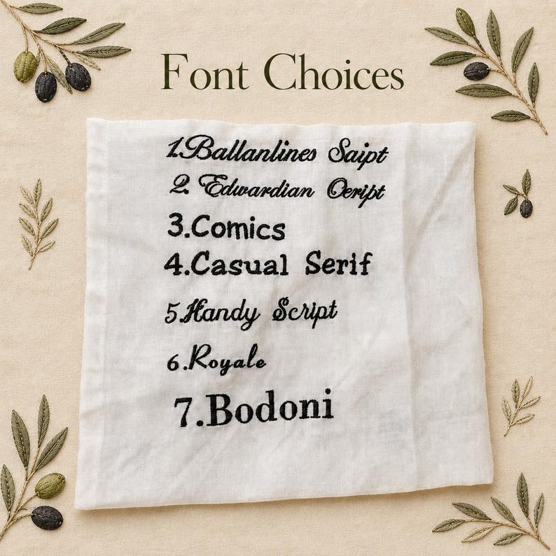 May include: A white fabric square shows seven embroidered black font options: Ballanlines Saipt, Edwardian Ceript, Comics, Casual Serif, Handy Script, Royale, and Bodoni. The words "Font Choices" are above the fonts. Olive branch designs are in the corners.