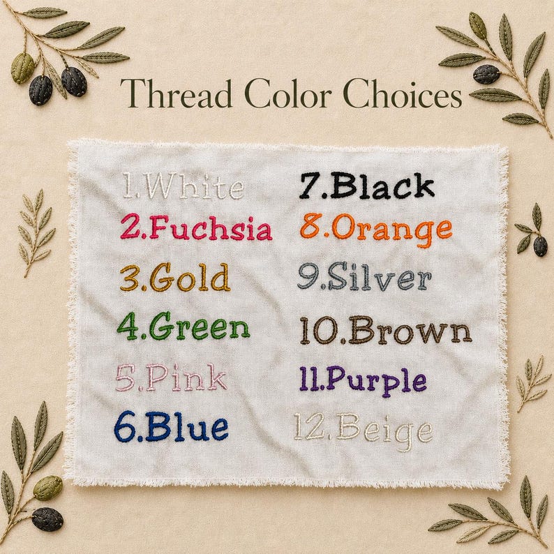 May include: A white fabric sample displaying embroidered thread colour options. The text reads "Thread Colour Choices" above a list of twelve colours, including White, Fuchsia, Gold, Green, Pink, Blue, Black, Orange, Silver, Brown, Purple, and Beige.