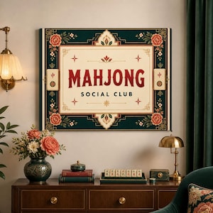 May include: A rectangular wall art piece with the words "MAHJONG SOCIAL CLUB" in a bold, vintage font. The artwork features a dark green border with floral and geometric designs, and a cream-colored central panel.