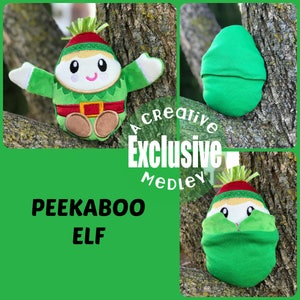May include: A green and red plush elf toy with a peekaboo feature. The elf has a green hat, a red and white striped scarf, and a green and white striped body. The elf's face is embroidered with a smile and eyes. The elf is sitting on a tree branch. The text "Peekaboo Elf" is written below the elf. The text "A Creative Exclusive Medley" is written above the elf.