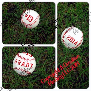 May include: White baseballs with red stitching and text. One ball has "#13" and "BRADY", another has "#13", and the last one has "2014". The baseballs are on green grass.