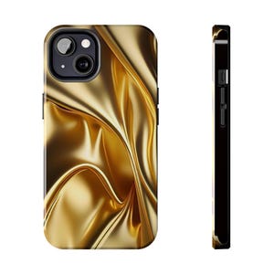 May include: A gold phone case with a flowing fabric design. The case has a glossy finish and a black border. The design resembles draped fabric, with highlights and shadows creating depth. The phone case is shown from the front and side.