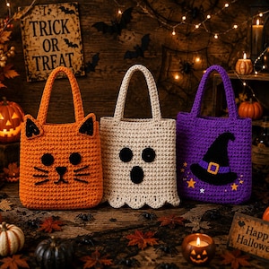 May include: Three crocheted Halloween tote bags featuring a cat face in orange, a ghost face in cream, and a witch hat in purple. Each bag has a sturdy handle and a textured yarn construction, designed for carrying treats during the holiday season.