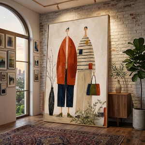 May include: A large framed artwork depicting two figures. One wears a red jacket and navy trousers, the other a striped top and beige trousers. A black vase with branches and a colourful tote bag are also visible.