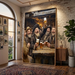 May include: A large framed wall art print depicting a group of bearded men in dark clothing sitting at a wooden table in a dimly lit tavern, laughing and holding up glasses of golden beer with white foam, set in a bright modern living room.