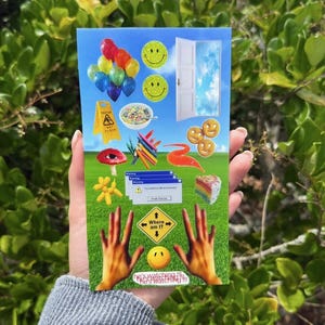 May include: A rectangular sticker sheet featuring a collage of colorful graphics on a green grass and blue sky background, including balloons, smiley faces, a door, a cereal bowl, crayons, a mushroom, a cake slice, and text reading Where am I.