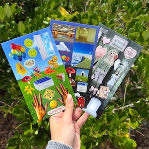 May include: Three rectangular stickers featuring collage-style designs. The left sticker displays a green field with balloons, smiley faces, a door, and a computer error window. The middle sticker shows backrooms, clouds, and mushrooms. The right sticker features gothic imagery, a teddy bear, and hearts.