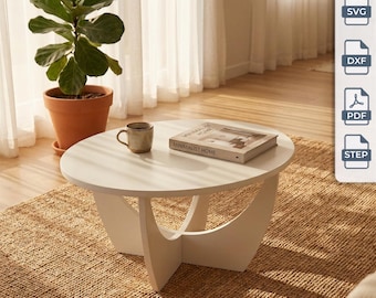 Può includere: Un tavolino da caffè ovale bianco con base curva, su cui sono appoggiati una tazza in ceramica marrone e un libro intitolato Minimalist Home. L'immagine include una barra laterale con il testo Digital Files e icone per SVG, DXF, PDF e STEP.