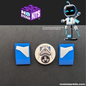 May include: A set of adhesive stickers for a building block toy, featuring two blue rectangular pieces with white accents and one circular piece with a gray mechanical fan design. The logo reads NO STICKER KITS. A small robot figure is shown for reference.