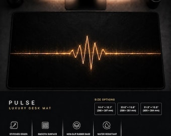 May include: A rectangular black desk mat featuring a glowing orange horizontal pulse wave graphic in the center. Text includes Pulse Luxury Desk Mat, size options ranging from 14.4 x 12.1 inches to 31.5 x 15.5 inches, and Surface Theory Studio.