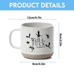 May include: White ceramic mug with a gray base and handle. The mug features black bat illustrations and the text "Well the FUCK aware." The mug is 3.5 inches tall, 4.7 inches wide, and 3.5 inches in diameter.