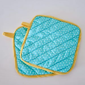 Set of two handmade quilted pot holders, bright fun blue stars, 8" x 8"